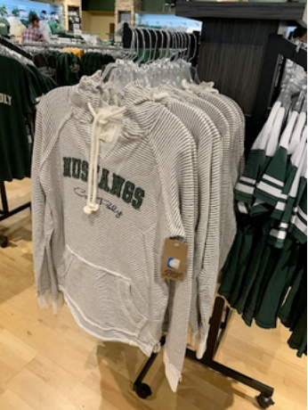 custom apparel merchandising display with organized rack layout designed to improve product presentation and sales flow