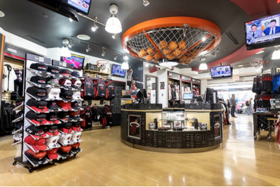 sports-themed airport retail environment with custom fixtures and merchandising layout designed for high-volume foot traffic