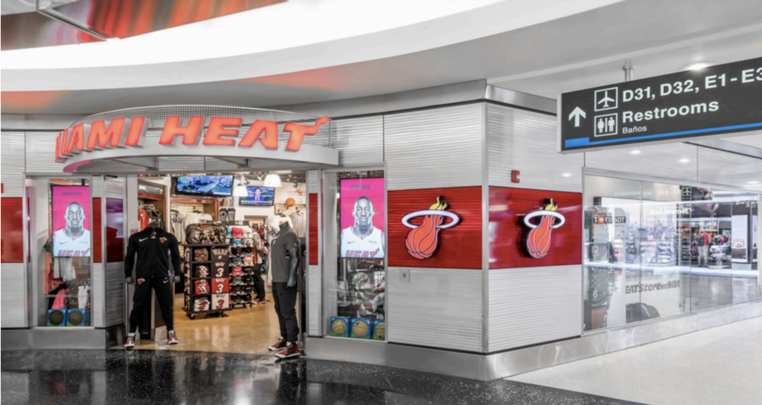 airport retail storefront design with bold branding and signage optimized for high-traffic customer capture